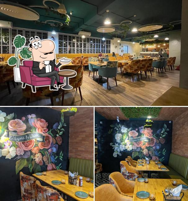 Take a seat at one of the tables at Thyme & Whisk Vegetarian Restaurant in Sarjapur Bangalore