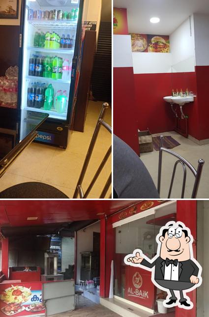 Take a seat at one of the tables at Al-Baik Restuarant, Nilamel