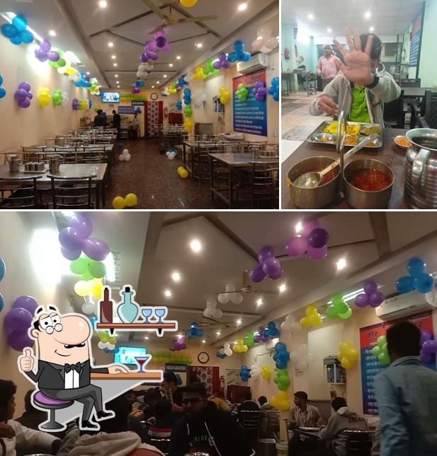 Take a seat at one of the tables at Sher-E-Bihar, Mess and Tiffin Center