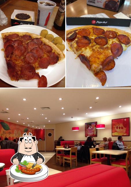 Esta é a foto apresentando comida e interior no Pizza Hut - Aeroporto TERMINAL 3