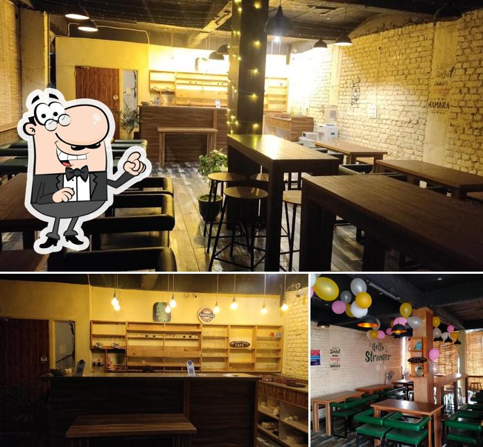 Take a seat at one of the tables at Good vibes cafe & restro