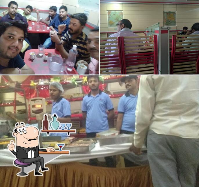 The image of interior and dining table at Neelam Sweets and Restaurant