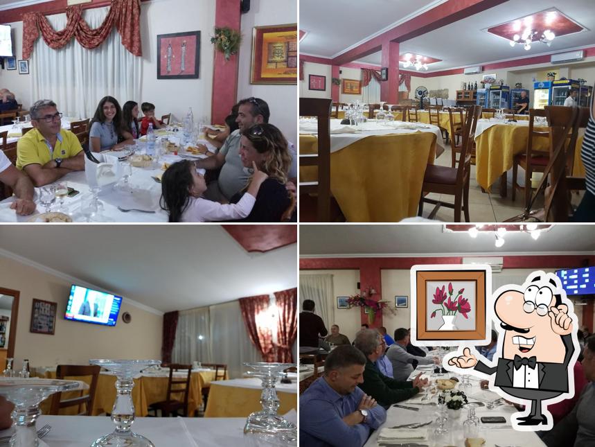 Siediti a un tavolo di Ristorante Pizzeria San Marco