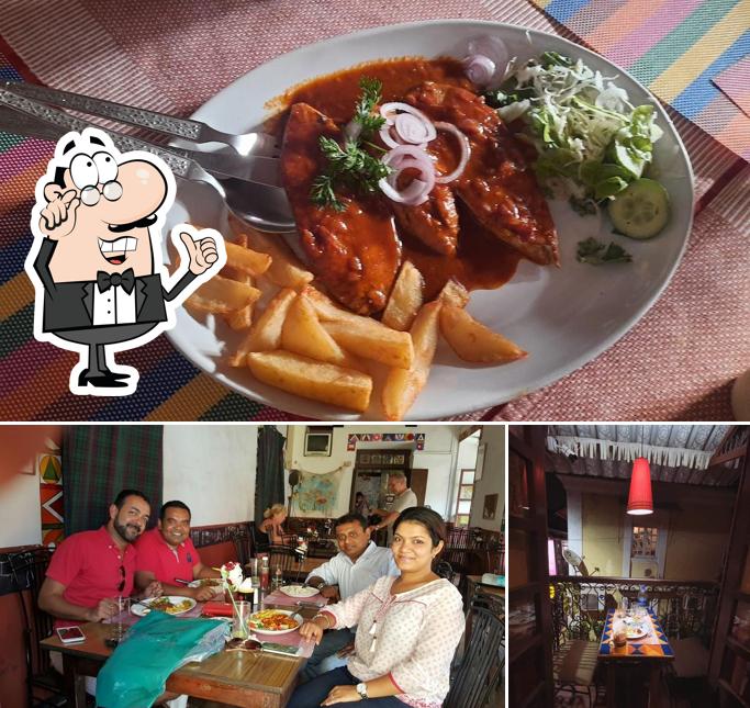 Take a seat at one of the tables at Hospedaria Venite Restaurant & Bar