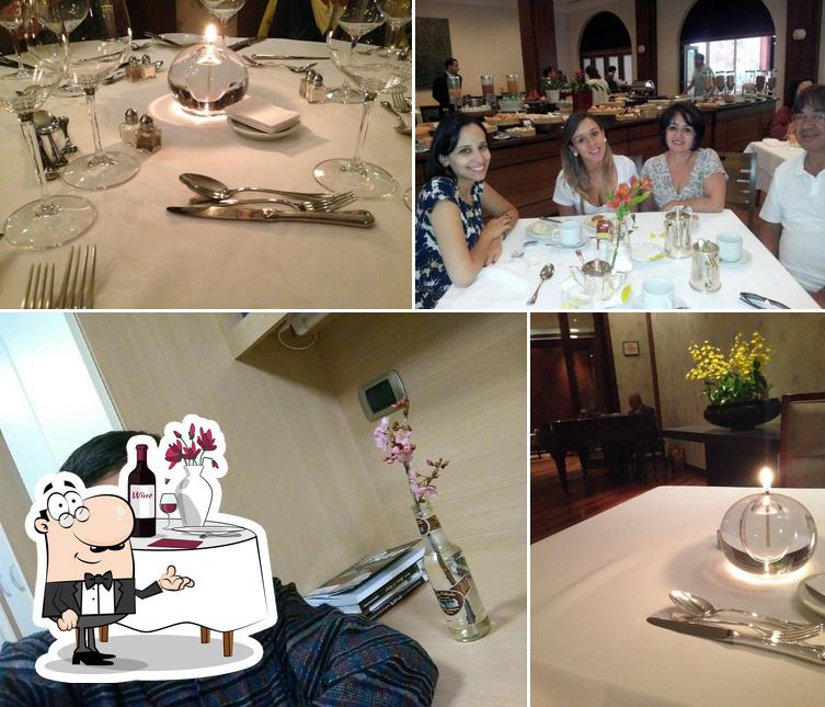 A imagem a Restaurante Araucária’s mesa de jantar e interior