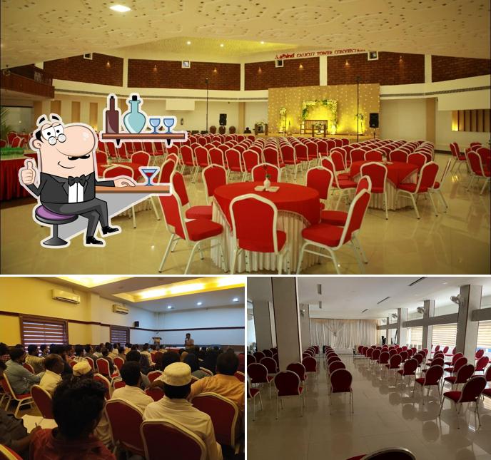 Take a seat at one of the tables at alhind Calicut Tower