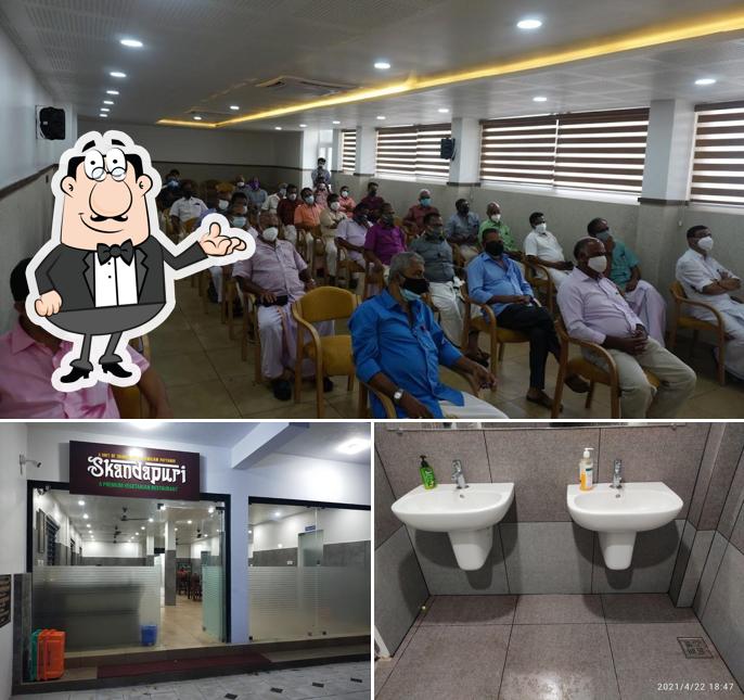 Take a seat at one of the tables at Skandapuri Restaurant സ്കന്ദപുരി റെസ്റ്റൊറന്റ്