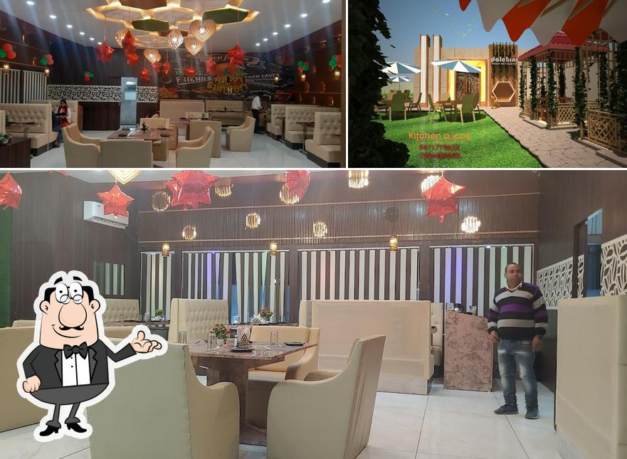 Take a seat at one of the tables at Dalchini restaurant