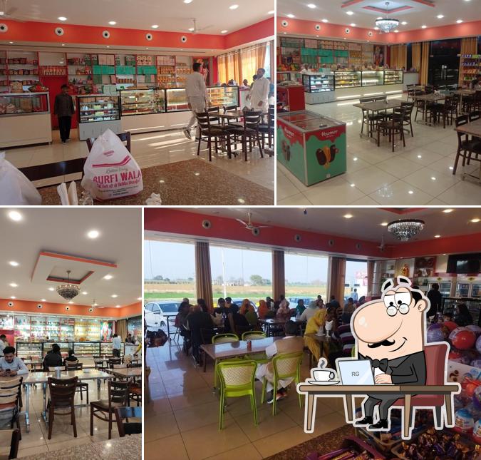 Take a seat at one of the tables at KRISHNA HAVELI