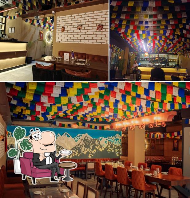 Take a seat at one of the tables at Yeti - The Himalayan Kitchen, Baner