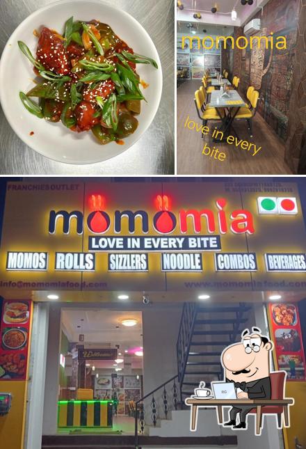 Take a look at the picture depicting interior and food at MOMOMIA in every bite