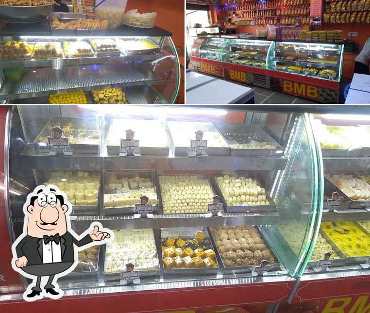 This is the image depicting interior and food at SHRI BAJRANG MISTHAN BHANDAR & NAMKEEN