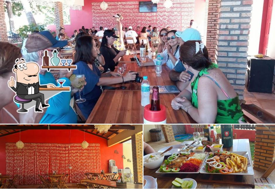 Sente em uma das mesas no Restobar Rei do Peixe