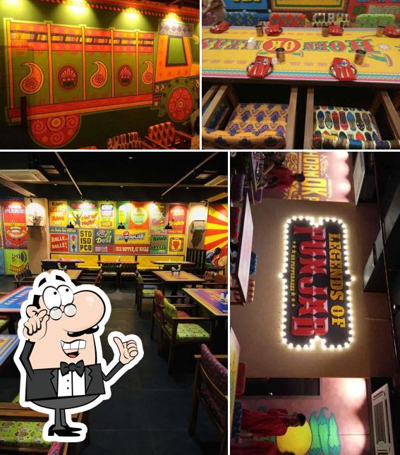 Take a seat at one of the tables at Legends of Punjab KUDASAN GANDHI NAGAR