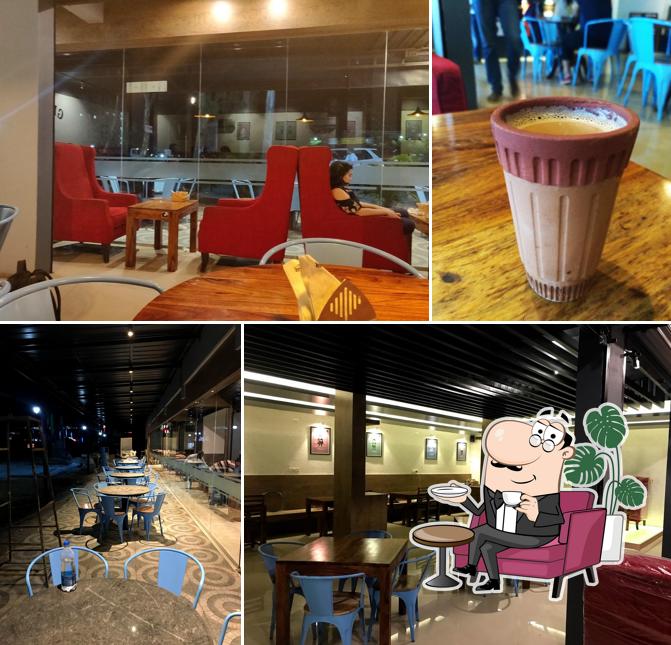 Take a seat at one of the tables at Gabbar Chai - Sompura