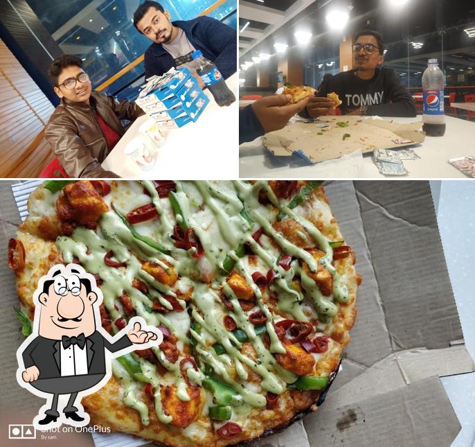 The photo of Domino's Pizza D.N Regalia Mall, Patrapada’s interior and pizza