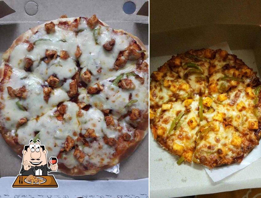 Get pizza at The Cafe Continental