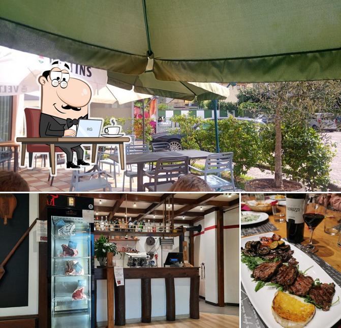 La immagine di interni e tavolo da pranzo da Ristorante Al Lupo