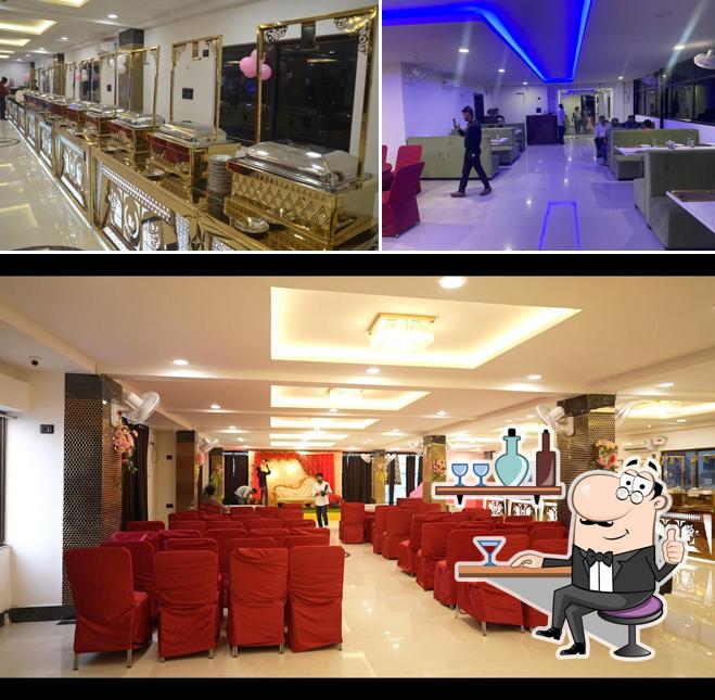 Take a seat at one of the tables at Royal Carpet: Hotel, Banquet Hall & Restaurant in Patna