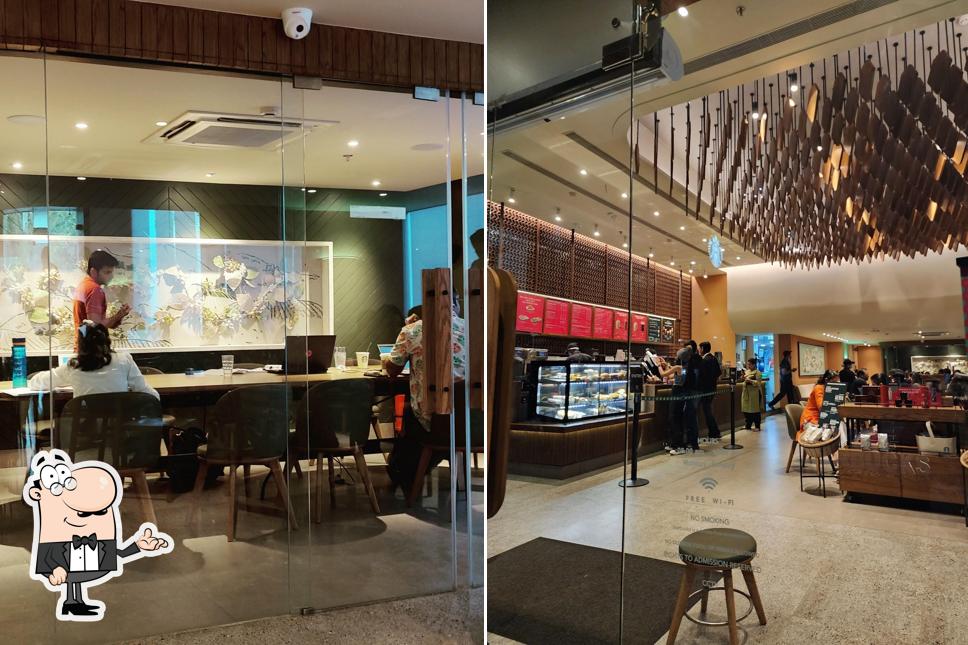 Take a seat at one of the tables at Starbucks