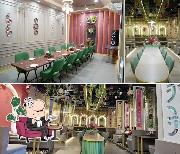 Take a seat at one of the tables at Mumbai restaurant(multi-cuisine)