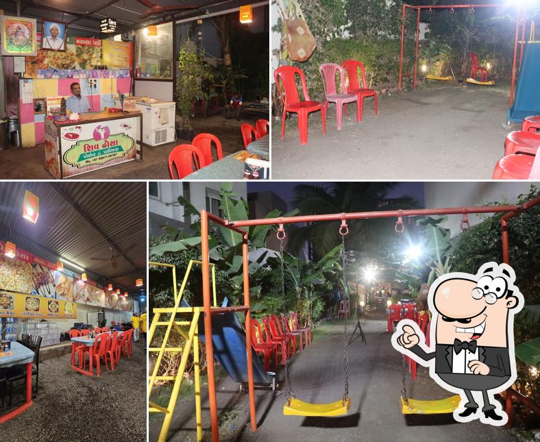 Take a seat at one of the tables at Shiv Dosa Point & Pavbhaji