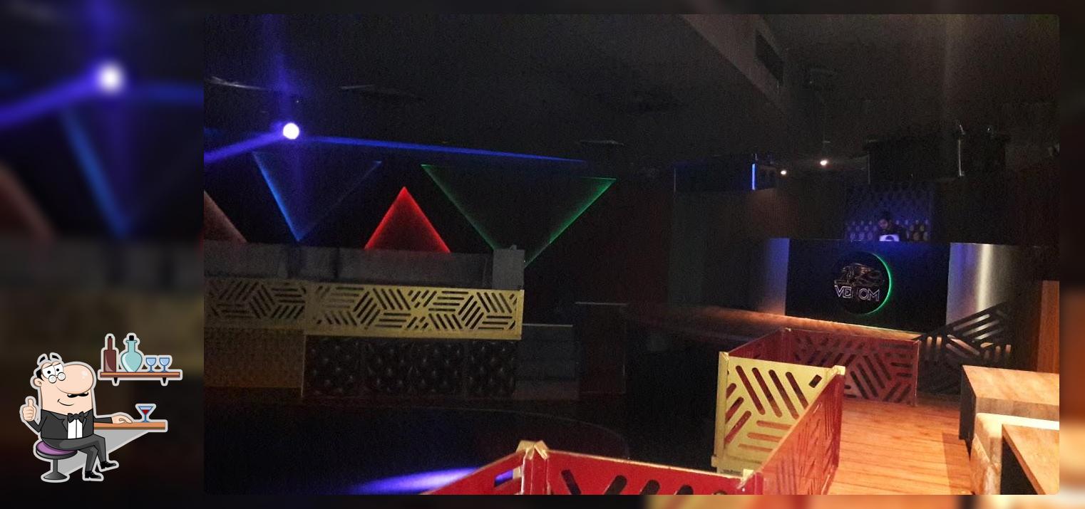 Take a seat at one of the tables at Venom Night Club