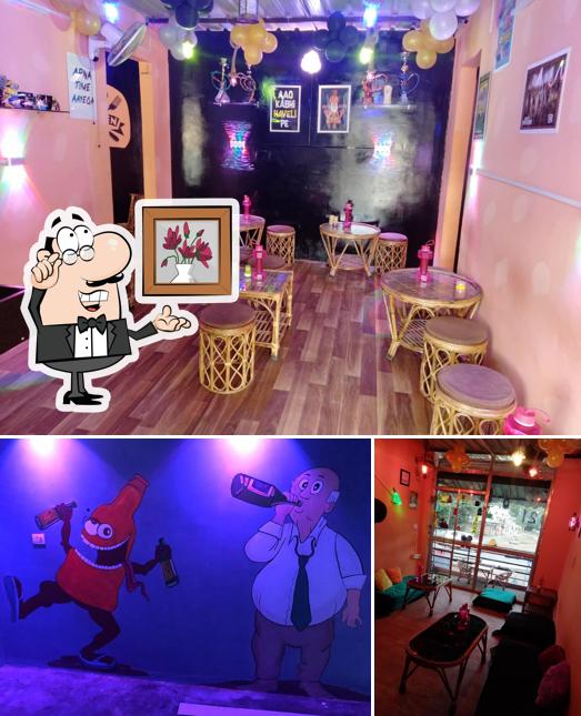 Take a seat at one of the tables at Bhukkad Cafe And Restro