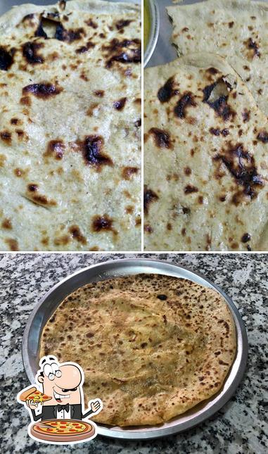 Order pizza at RAJ RESTAURANT