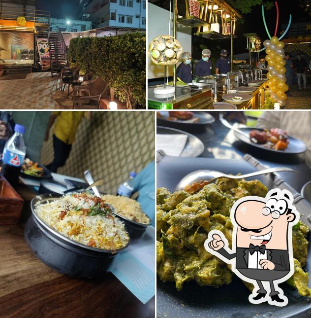 Take a seat at one of the tables at 90's Cafe & Restaurant