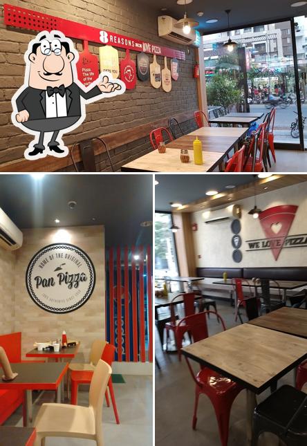 Take a seat at one of the tables at Pizza Hut Pimple Saudagar