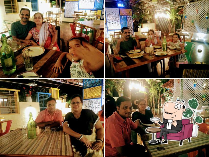 Take a seat at one of the tables at O'LEAF Taste Ka Tadka. Multicuisine Restaurant