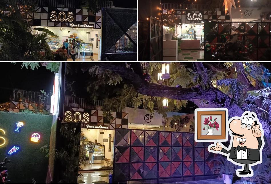 Take a seat at one of the tables at share over smiles Bistro & Cafe