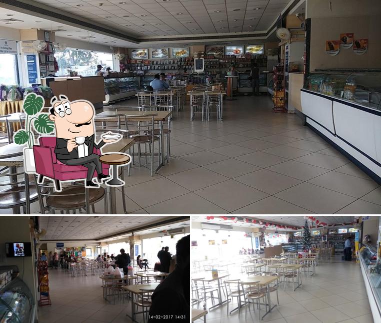 Take a seat at one of the tables at Kanha Restaurant