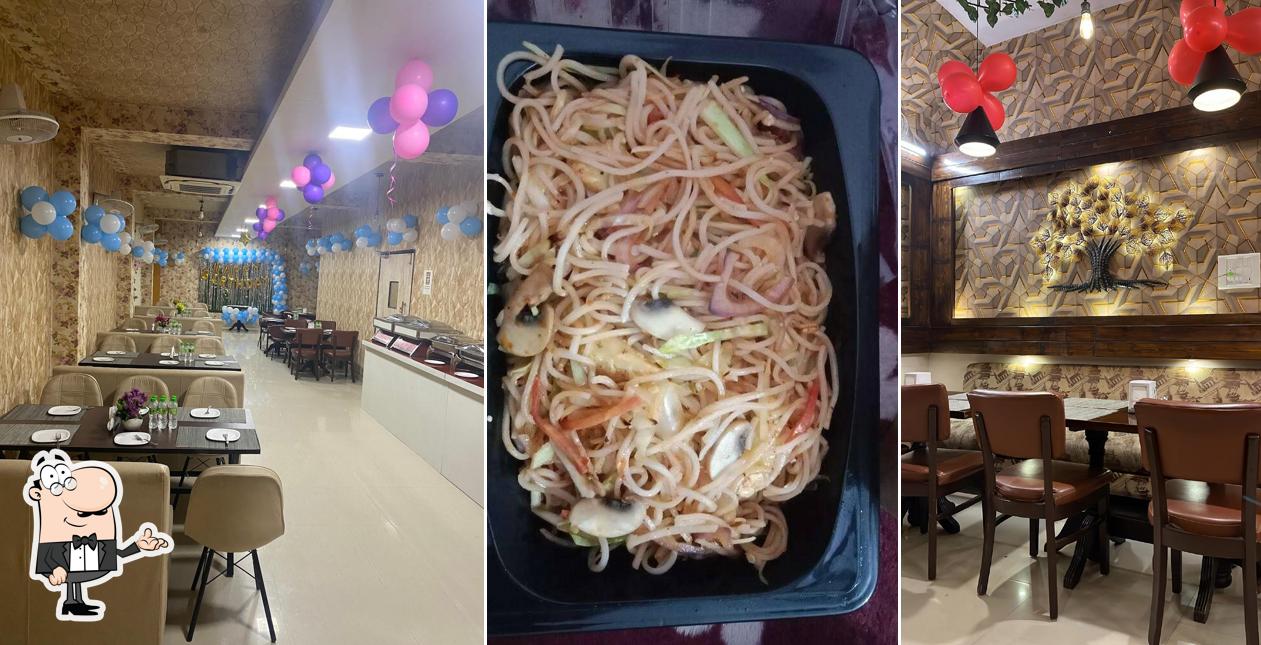 Take a seat at one of the tables at m-way Restro & Cafe ,Party Hall (A Unit of Mehendiram)