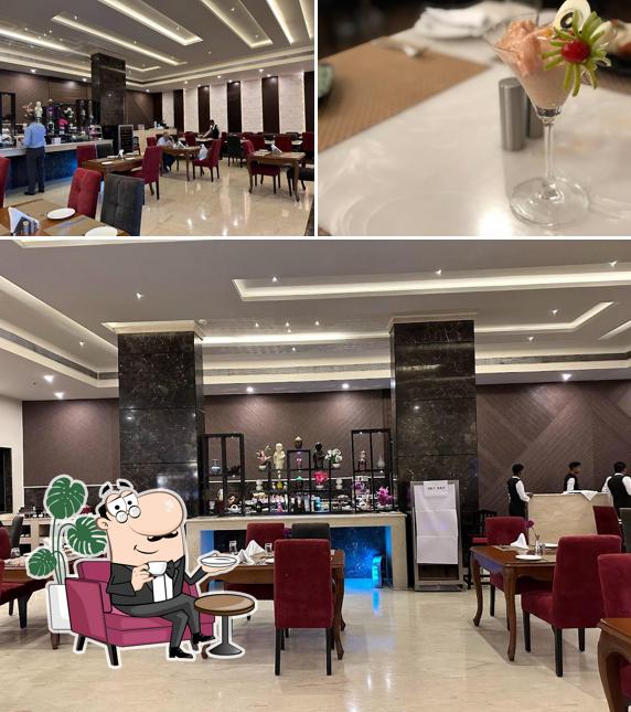 This is the image displaying interior and alcohol at Jampot CoffeeShop