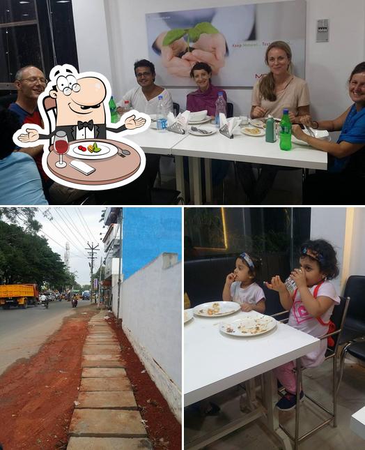 Moguls Restaurant is distinguished by dining table and exterior