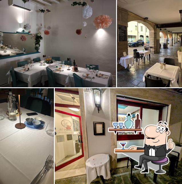 Dai un'occhiata agli interni di Al Porti.Co Restaurant & Wine