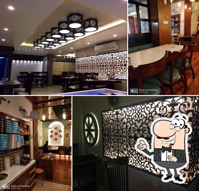 Take a seat at one of the tables at Rajesh Sweets and Bakers, Best Sweet Shop In Varanasi Best Sweets In Varanasi Best Restaurant In Varanasi