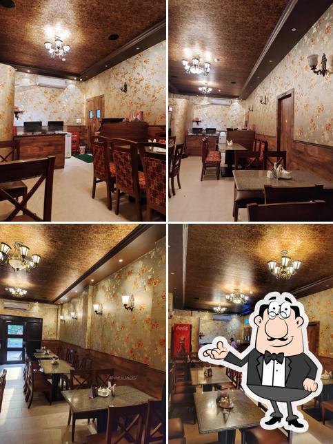 Take a seat at one of the tables at Hatari Restaurant