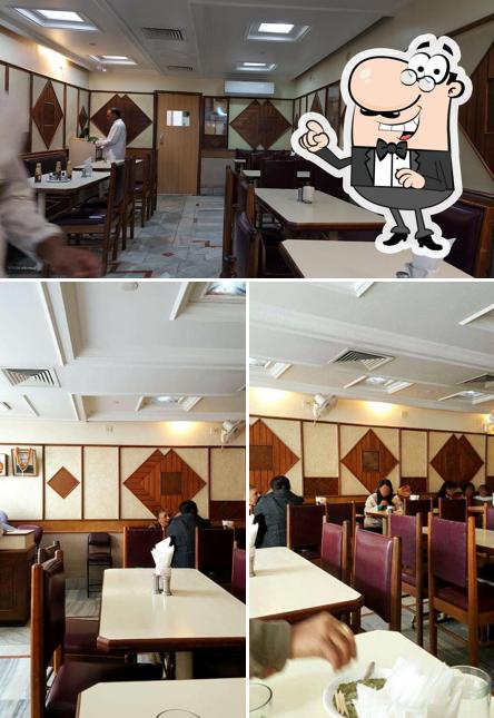 Take a seat at one of the tables at Bansi Vihar Restaurant