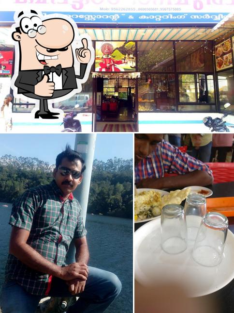 Look at the picture of Hotel Thampuran, pullanimukku