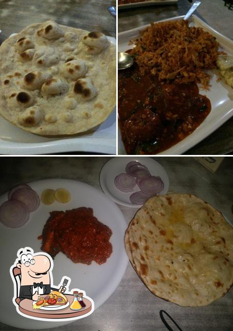 Get pizza at Lalit Family Restaurant & Bar