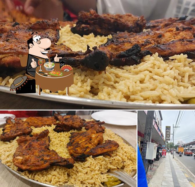 This is the picture displaying food and exterior at QASWA kuzhimanthi