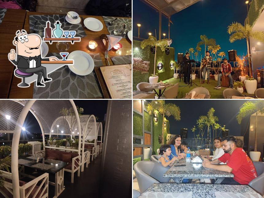 Check out how QAENAT MULTICUISINE ROOFTOP RESTAURANT looks inside