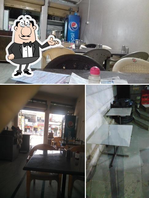 Among different things one can find interior and dining table at Jalgaji bhojnalaya