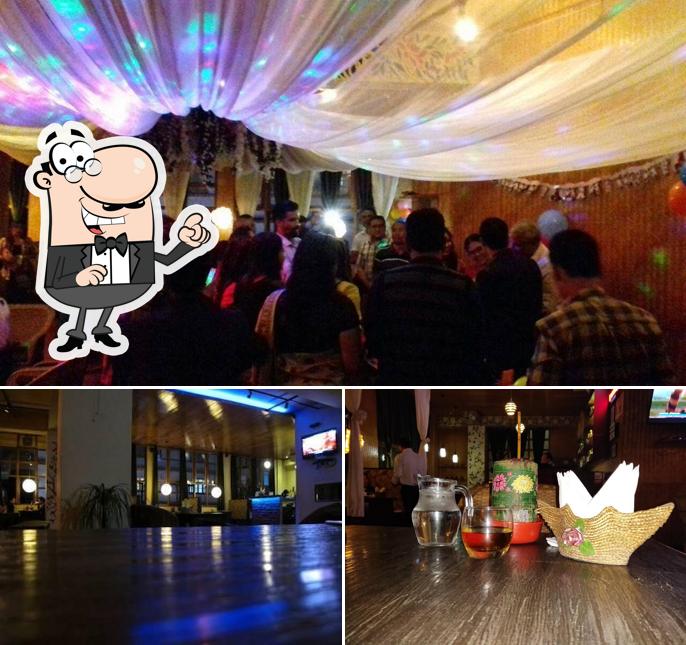 Take a seat at one of the tables at Absolute Demazong Restaurant