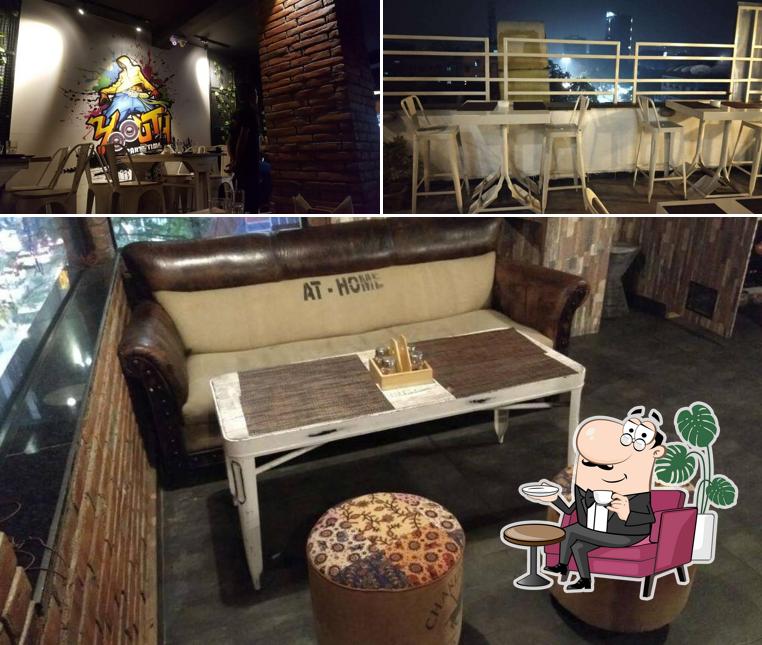 Take a seat at one of the tables at NH Sky Lounge