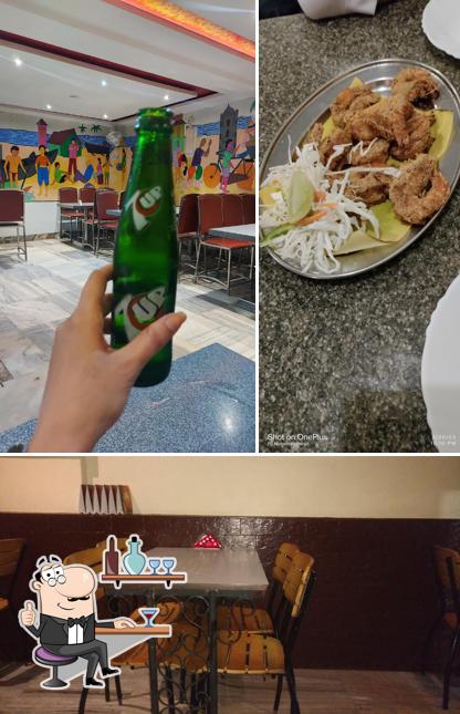 Take a seat at one of the tables at Pergola Bar & Restaurant