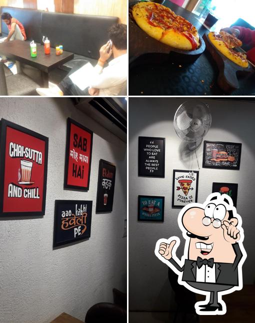 Take a seat at one of the tables at Vegan Pizzeria